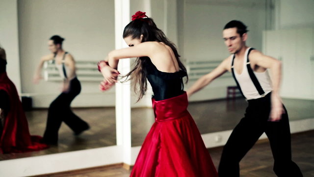 Montage of professional dancers dancing tango in ballroom