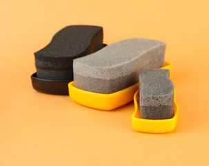 Shoe shine sponges, on color background