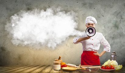 Asian female cook holding megaphone