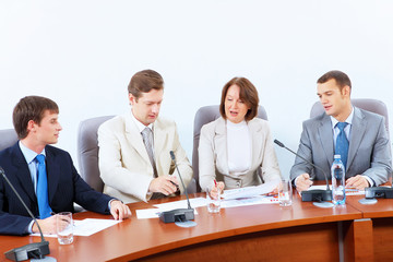 Four businesspeople at meeting