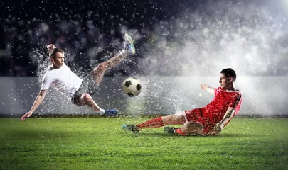 Acrylic prints Football two football players striking the ball