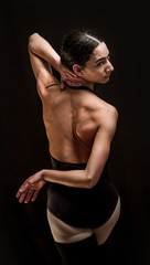 woman backs holding her neck