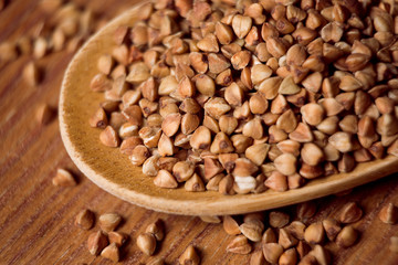 buckwheat groats and wooden spoon