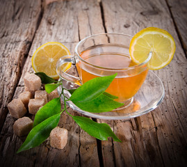 Cup of green tea on wood board