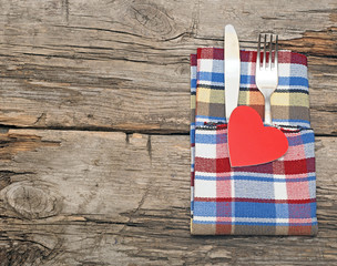 Cutlery set with colorful napkin and heart