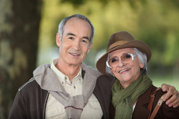Fototapeta premium Elderly couple on an autumnal walk
