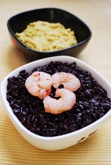 Black rice with shrimp and chickpeas cream