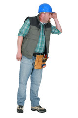 Builder looking into the distance