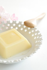 Japanese cuisine, egg tofu with flower on background