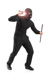 Robber with robbery mask holding a flashlight and piece of pipe