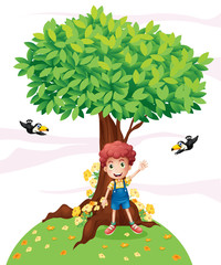 Un jeune garçon debout sous un grand arbre avec deux oiseaux