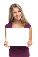 Fototapeta premium Smiling woman showing blank signboard