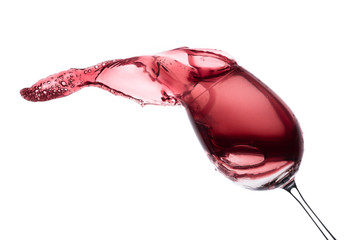 red wine splashing out of a glass, isolated on white