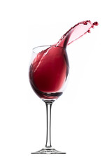 red wine splashing out of a glass, isolated on white
