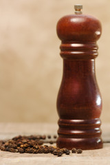 black pepper grain and pepper grinder