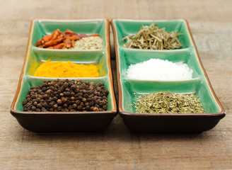 common spices over green exotic bowl