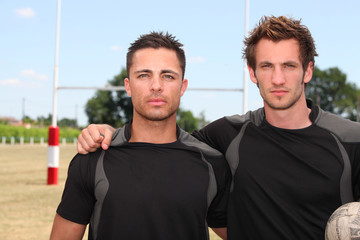 two serious football players