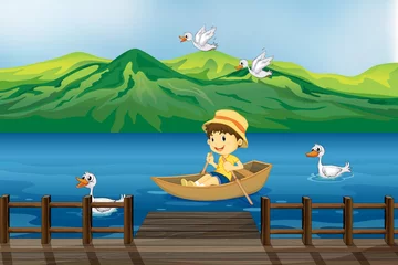 Cercles muraux Rivière, lac Un garçon monté sur un bateau en bois
