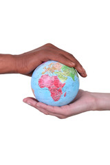 black and white hands holding globe
