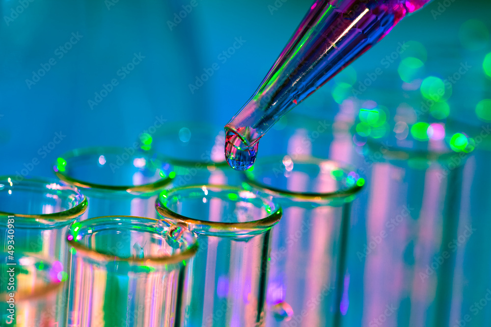Wall mural pipette adding fluid to one of several test tubes