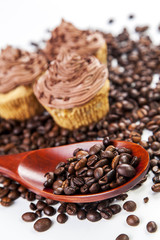 Chocolate cream muffins and cofee beans