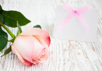 Blank card for your message and pink rose