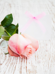 Blank card for your message and pink rose