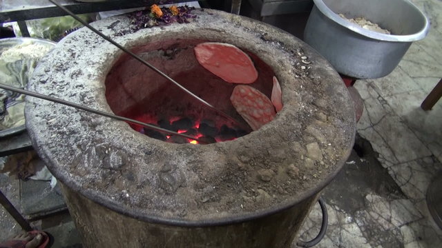 Baking Chapati In Delhi Street Market, India