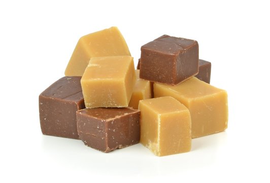 A Pile Of Vanilla And Chocolate Fudge On A White Background