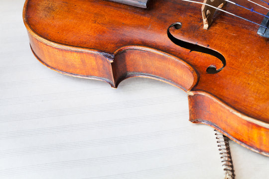 violin bout with f-hole on music book