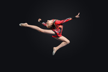 Naklejka premium Young woman in gymnast suit posing