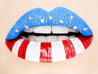 Fototapeta premium Beautiful female lips painted with American flag