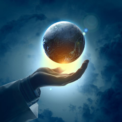 Image of earth planet on hand