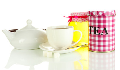 Jar and cup of tea isolated on white