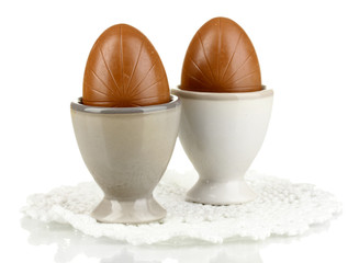 Chocolate eggs in stand isolated on white
