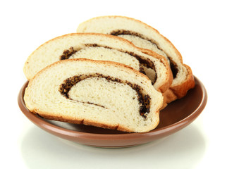 Loaf with poppy seeds on color plate, isolated on white