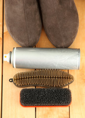 Set of stuff for cleaning and polish shoes, on wooden