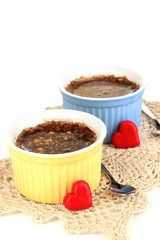 Chocolate pudding in bowls for baking isolated on white