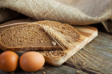 fresh bread and wheat on the wooden