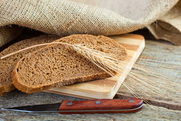 fresh bread and wheat on the wooden