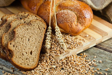fresh bread and wheat on the wooden