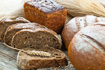 fresh bread and wheat on the wooden