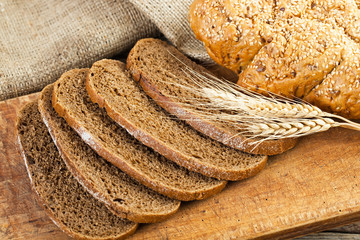 fresh bread and wheat on the wooden