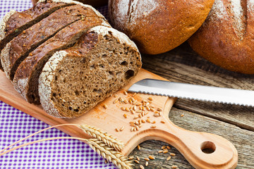 fresh bread and wheat on the wooden