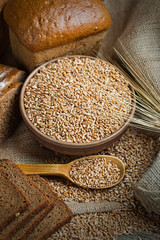 fresh bread and wheat on the wooden