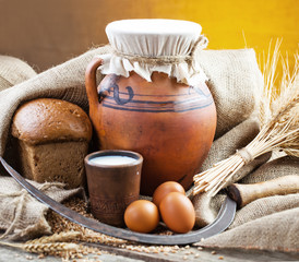 fresh bread and wheat on the wooden