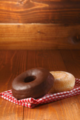 Delicious fresh chocolate and sugared doughnuts
