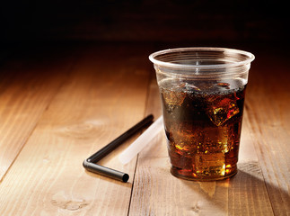 Disposable cup of soda