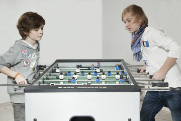 Two boys play table football2