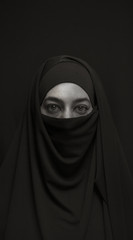 Fototapeta na wymiar woman in burka over dark background